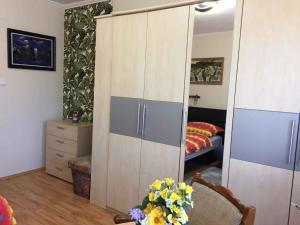 A bed or beds in a room at House and Apartment Balatonmariafürdo 19319