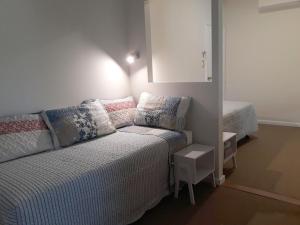 a bed room with a white bedspread and white pillows at 101 Oatlands in Mount Barker