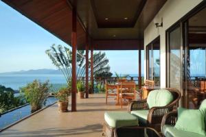 a porch of a house with a view of the ocean at 4 Bedroom 300 degrees Sea View Villa SDV139A-By Samui Dream Villas in Koh Samui 
