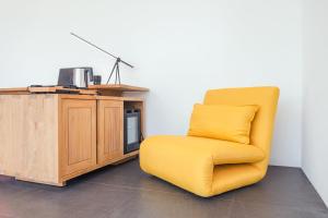 A television and/or entertainment centre at K Gallery Hotel