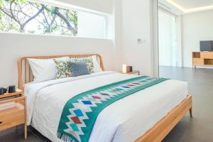 A bed or beds in a room at K Gallery Hotel