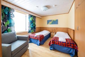 Postel nebo postele na pokoji v ubytování Hotel Utsjoki
