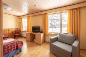 TV a/nebo společenská místnost v ubytování Hotel Utsjoki