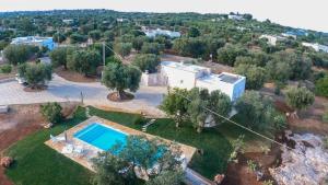 an aerial view of a house with a swimming pool at Trullo Nadia Ostuni in Ostuni