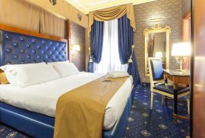 Postel nebo postele na pokoji v ubytování Hotel Manfredi Suite In Rome