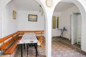 two views of a room with a table and a hallway at Этаж под ключ в гостевом доме in Anapa