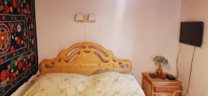 Postel nebo postele na pokoji v ubytování Ethno Guest House Caravan Tamchy