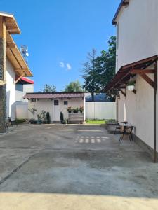 an empty parking lot in front of a building at Luca's studio 2 ,Close to Therme Bucharest, Airport Otopeni in Baloteşti