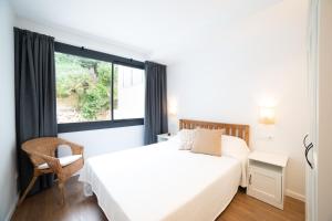 Apartaments Voralmar客房内的一张或多张床位