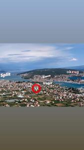 a red circle in the middle of a city at Apartments Angelus in Trogir