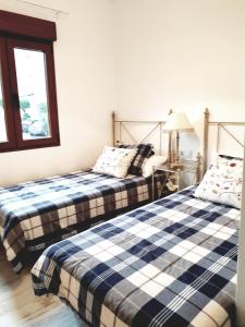 A bed or beds in a room at APARTAMENTO VISTAS AL MAR Sanxenxo