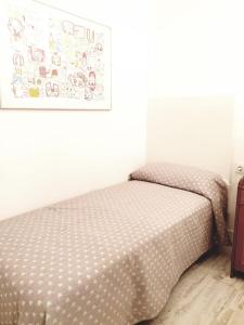 A bed or beds in a room at APARTAMENTO VISTAS AL MAR Sanxenxo