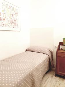 A bed or beds in a room at APARTAMENTO VISTAS AL MAR Sanxenxo