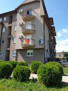 a building with balconies on the side of it at Lux Apartman Ristić 2 in Soko Banja