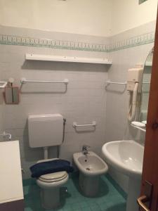 a bathroom with a toilet and a sink at Miniloft panoramico in Rio nellʼElba