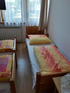 Postel nebo postele na pokoji v ubytování Pod Tatarską Górą