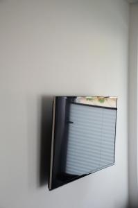 Televízia a/alebo spoločenská miestnosť v ubytovaní Appartement HANNE