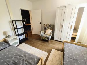 A bed or beds in a room at Apartman Panorama Park & Free Parking