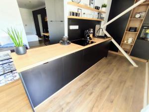 A kitchen or kitchenette at Apartman Panorama Park & Free Parking