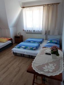 Postel nebo postele na pokoji v ubytování Pod Tatarską Górą
