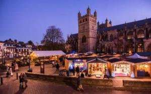 a city with christmas markets in front of a building at New North House by Staytor Accommodation in Exeter