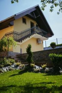 a house with a balcony on the side of it at Apartment Oddih in Bled