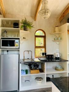 A kitchen or kitchenette at Treedom Villas and Vardos