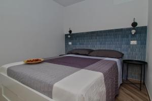 Letto o letti in una camera di B&B Sea and Garden