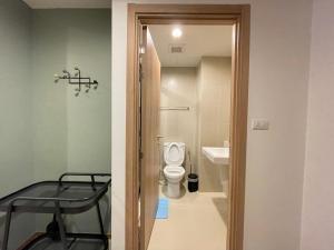 a bathroom with a toilet and a sink at Getway at Lahabana huahin in Hua Hin