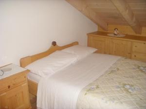 Postel nebo postele na pokoji v ubytování Albergo Garni' Laura