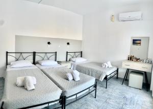 Giường trong phòng chung tại Kedros Rooms