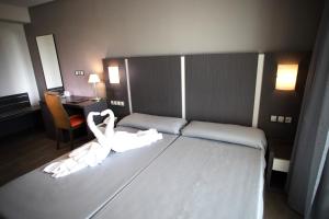 Postel nebo postele na pokoji v ubytování El Chalet