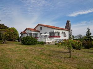 a large white house with a large yard at Finca Engracia in Cudillero