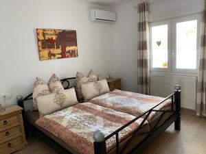 Łóżko lub łóżka w pokoju w obiekcie Villa Emilia 8 PAX