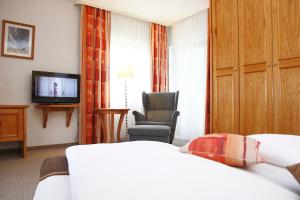 A television and/or entertainment centre at Hotel Magerl