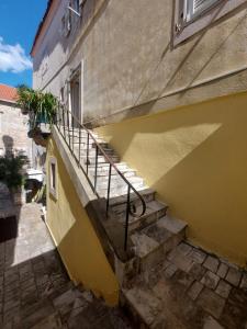 a set of stairs leading up to a building at Old Town Experience - Studio Apartment in Budva