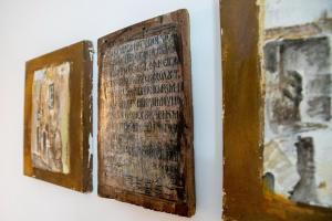 two books hanging on a wall at Areopolis Central in Areopoli