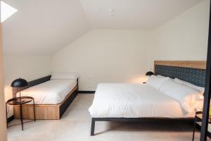 Cama o camas de una habitación en LATROUPE La Granja