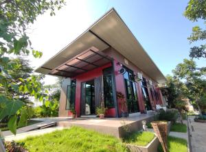 a small house with a red at Morinaka Craftfe & Poshtel 