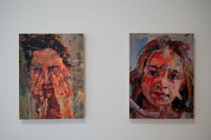 two paintings of a woman on a wall at Oporto Classic Terrace in Porto
