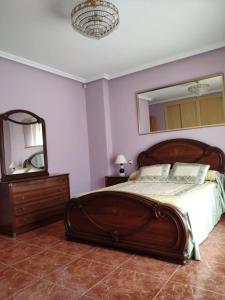 Posteľ alebo postele v izbe v ubytovaní CASA LOS ABUELOS