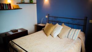 Säng eller sängar i ett rum på Castellabate Apartments Casa Cardone