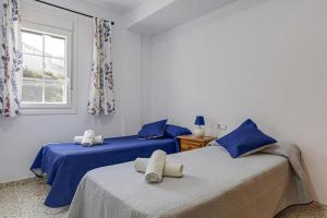Postel nebo postele na pokoji v ubytování Apartamento María