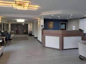 an office lobby with a reception counter and desks at Comfort Inn & Suites Wyomissing-Reading in Wyomissing