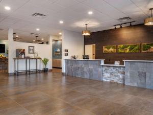 an empty lobby with a reception desk in a building at The Cranberry, Ascend Hotel Collection in Morgantown