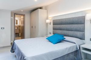 Postel nebo postele na pokoji v ubytování Versilia Residence - Colombo