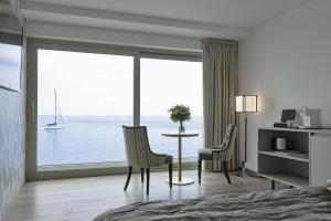 a hotel room with a view of the ocean at Sublimis Boutique Hotel Adults-Only in Camogli