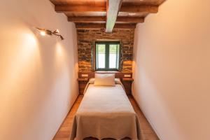 Postel nebo postele na pokoji v ubytování Apartamentos Rurales Casa Llongo