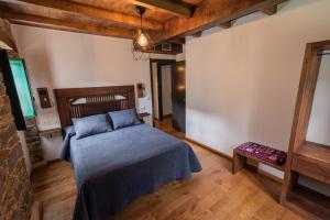 Postel nebo postele na pokoji v ubytování Apartamentos Rurales Casa Llongo