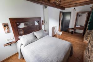 Postel nebo postele na pokoji v ubytování Apartamentos Rurales Casa Llongo